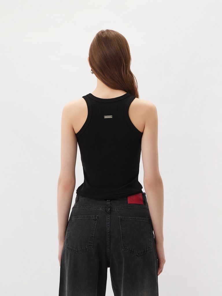 Sleeveless top with a metal logo badge