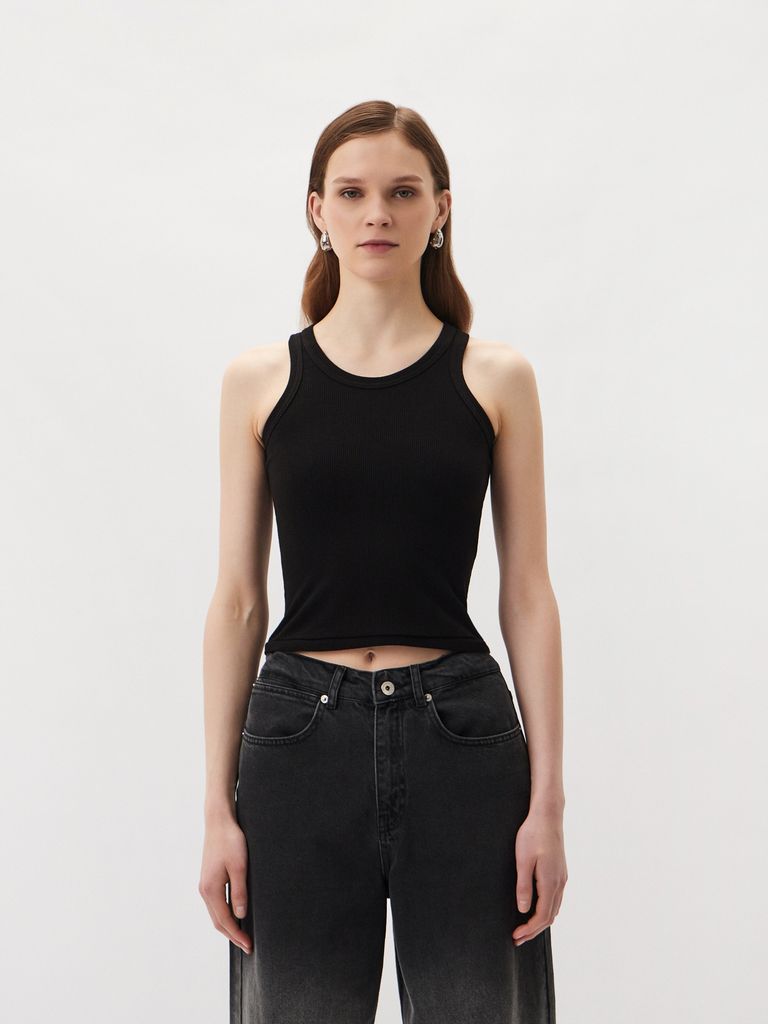 Sleeveless top with a metal logo badge