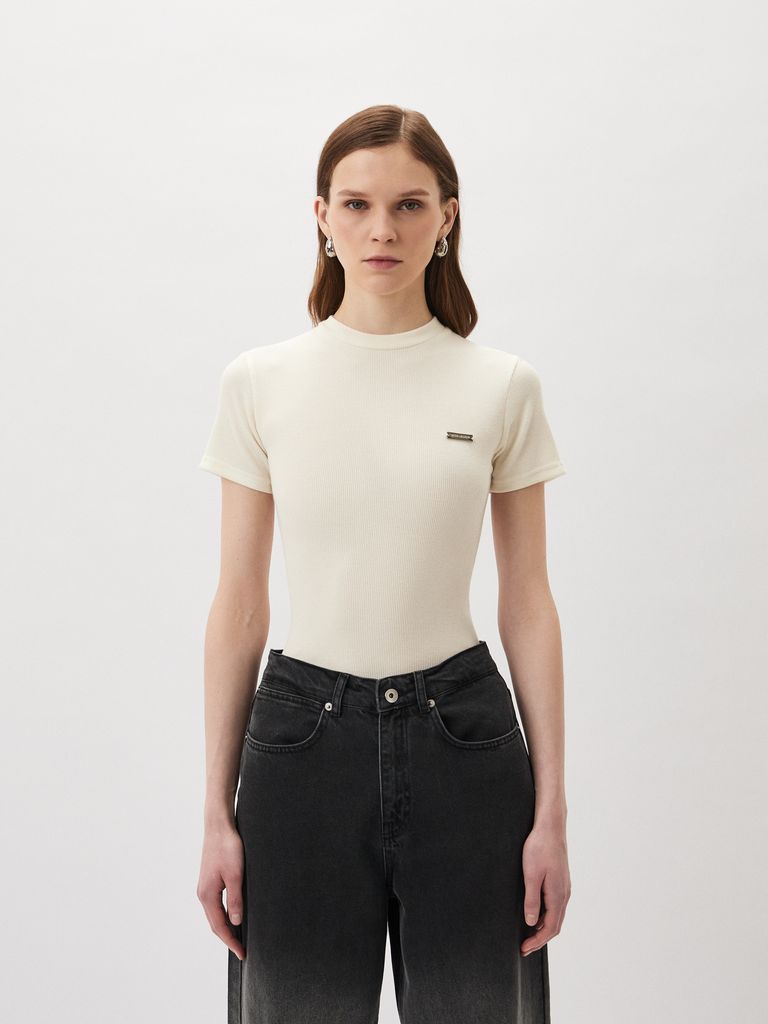 Top with a Silver Logo Badge
