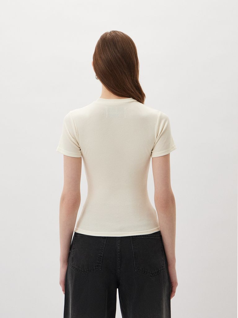 Top with a Silver Logo Badge