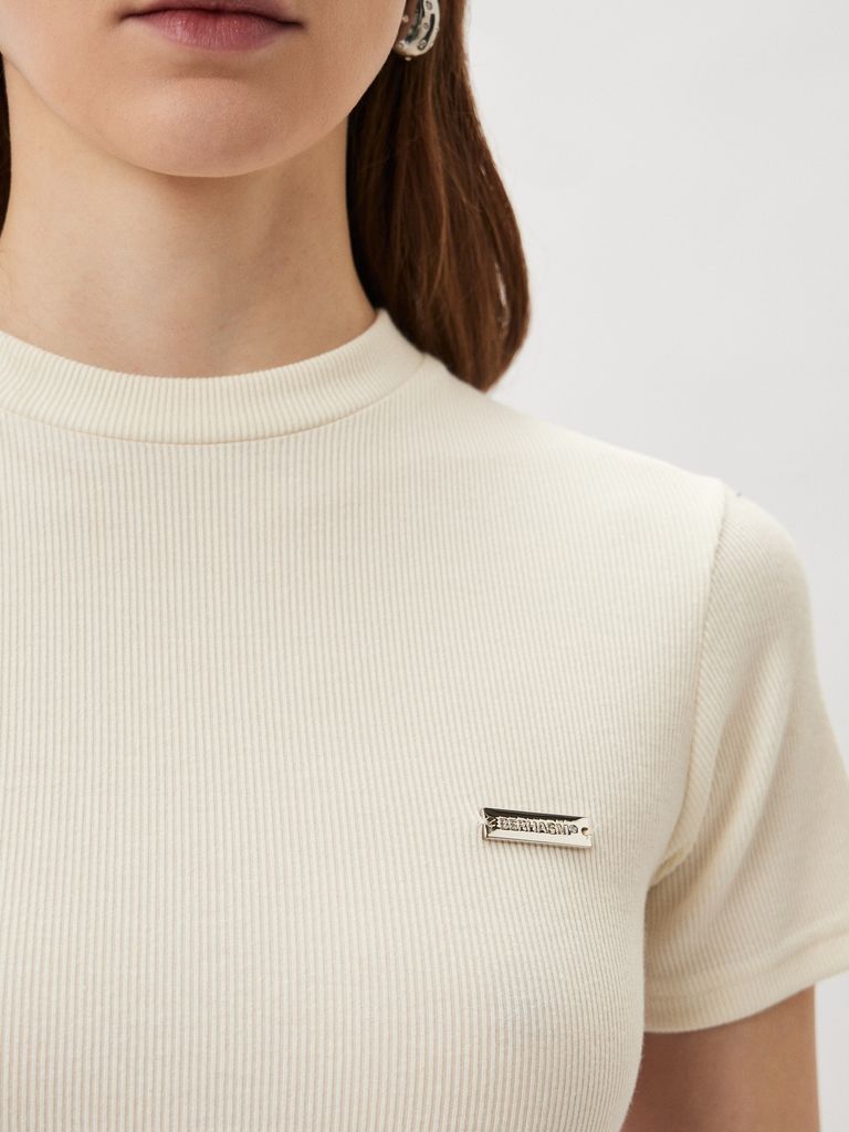Top with a Silver Logo Badge